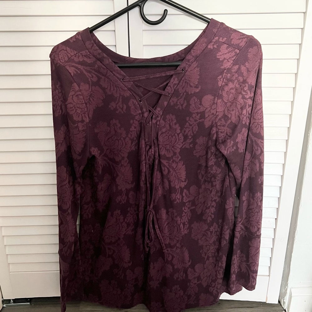 Long sleeve burgundy sweater with floral print and criss cross tie on back